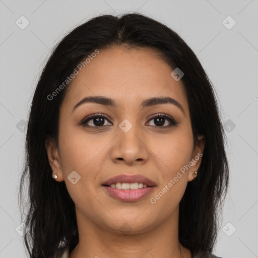 Joyful latino young-adult female with long  brown hair and brown eyes