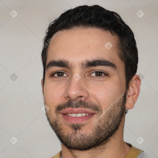 Joyful white young-adult male with short  black hair and brown eyes