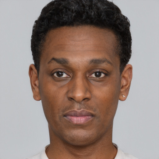 Neutral black young-adult male with short  black hair and brown eyes