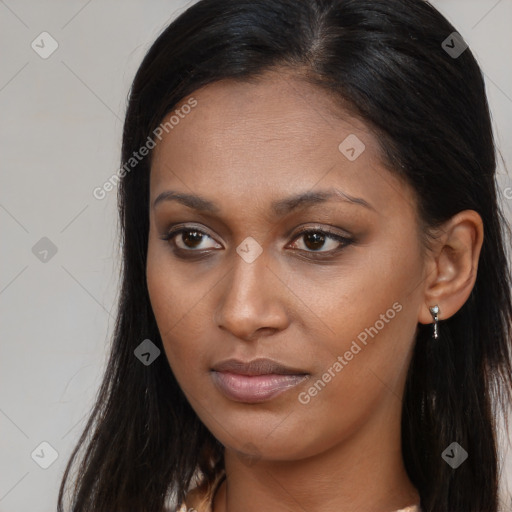 Joyful latino young-adult female with long  brown hair and brown eyes