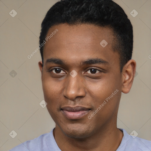 Joyful black young-adult male with short  black hair and brown eyes