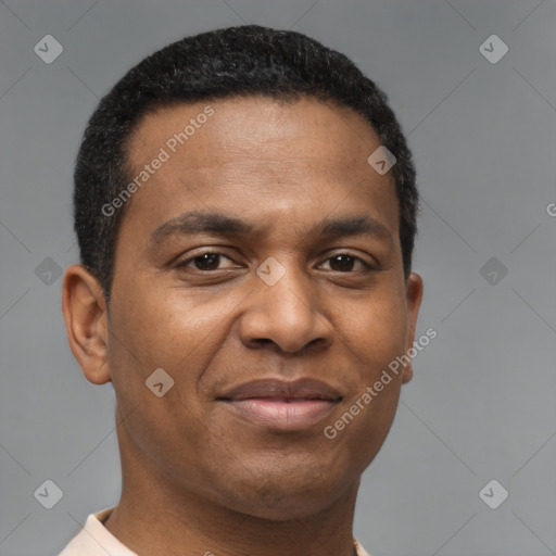Joyful black young-adult male with short  brown hair and brown eyes