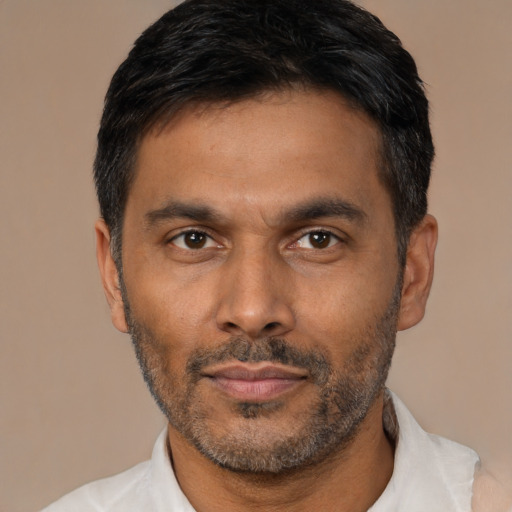 Neutral latino adult male with short  black hair and brown eyes
