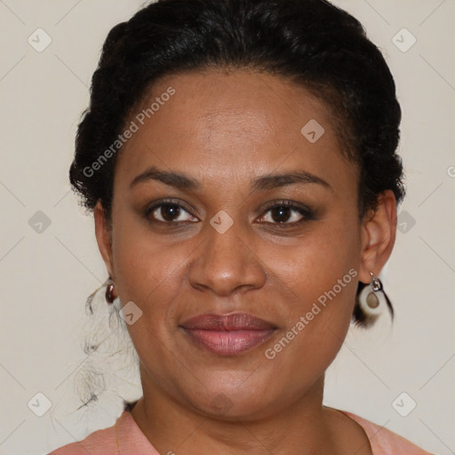 Joyful black adult female with short  brown hair and brown eyes