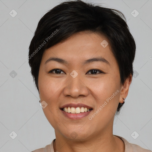 Joyful asian young-adult female with short  black hair and brown eyes