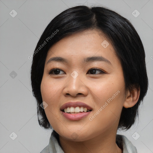 Joyful asian young-adult female with medium  black hair and brown eyes