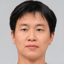 Neutral asian young-adult male with short  brown hair and brown eyes