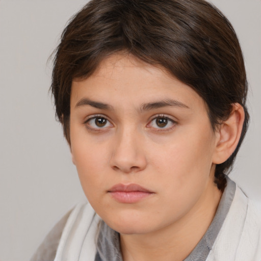 Neutral white young-adult female with short  brown hair and brown eyes