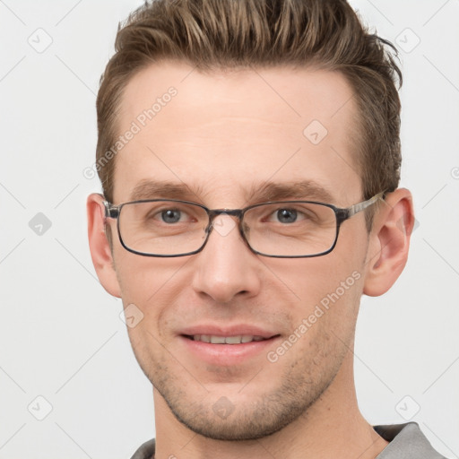 Joyful white adult male with short  brown hair and grey eyes