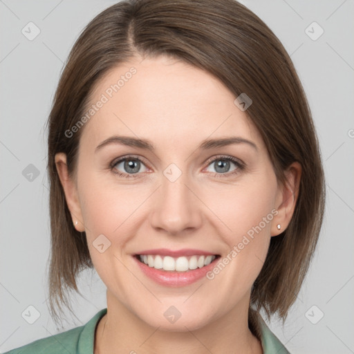 Joyful white young-adult female with medium  brown hair and grey eyes