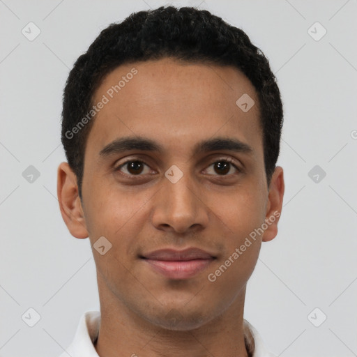 Joyful latino young-adult male with short  brown hair and brown eyes