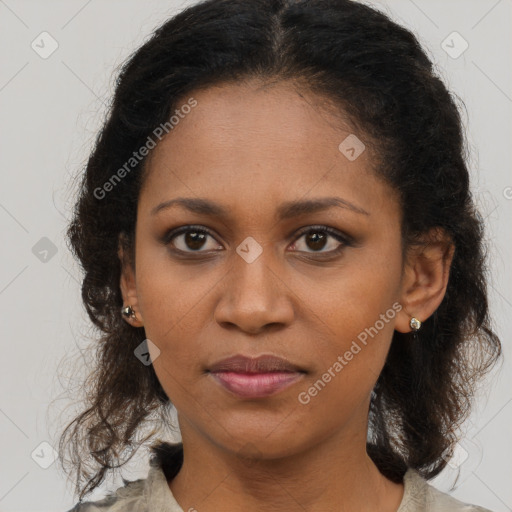 Joyful black young-adult female with medium  brown hair and brown eyes