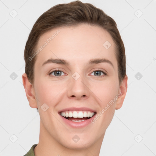 Joyful white young-adult female with short  brown hair and grey eyes