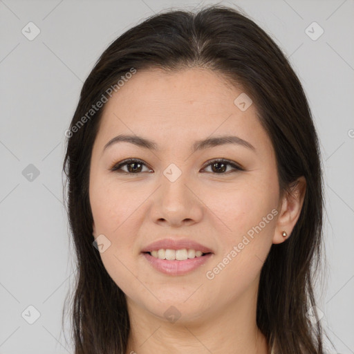 Joyful asian young-adult female with long  brown hair and brown eyes