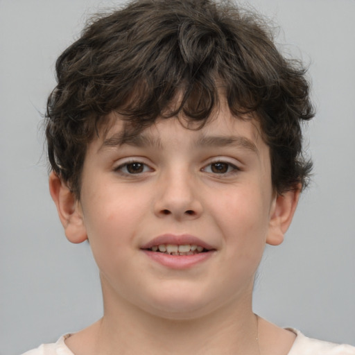 Joyful white child male with short  brown hair and brown eyes