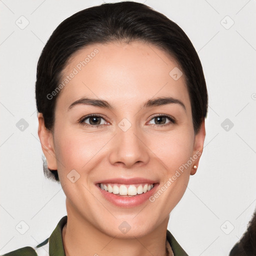 Joyful white young-adult female with short  brown hair and brown eyes