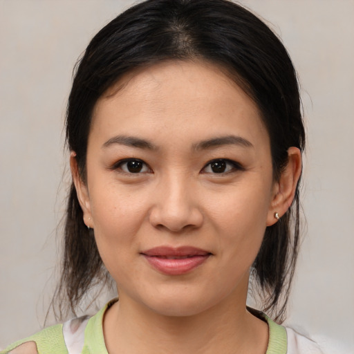 Joyful white young-adult female with medium  brown hair and brown eyes