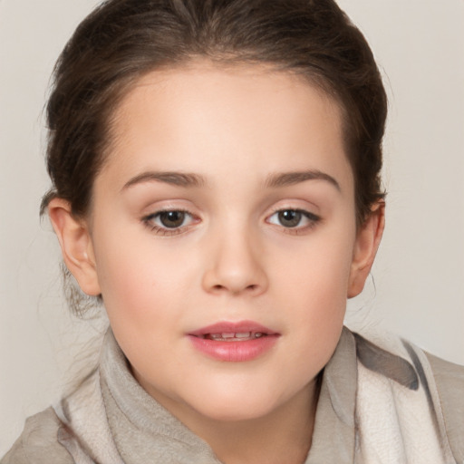 Joyful white child female with medium  brown hair and grey eyes