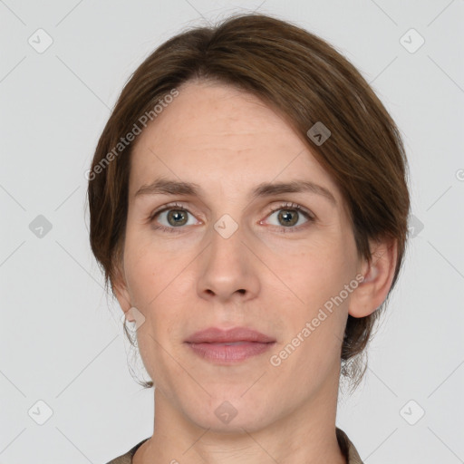 Joyful white adult female with medium  brown hair and grey eyes