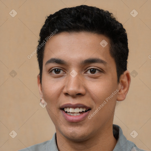 Joyful white young-adult male with short  black hair and brown eyes