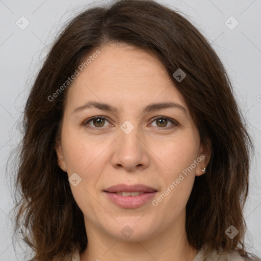 Joyful white adult female with long  brown hair and brown eyes