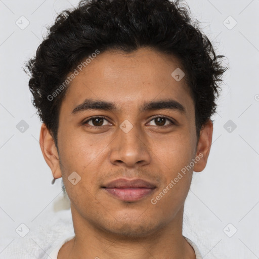 Joyful latino young-adult male with short  brown hair and brown eyes