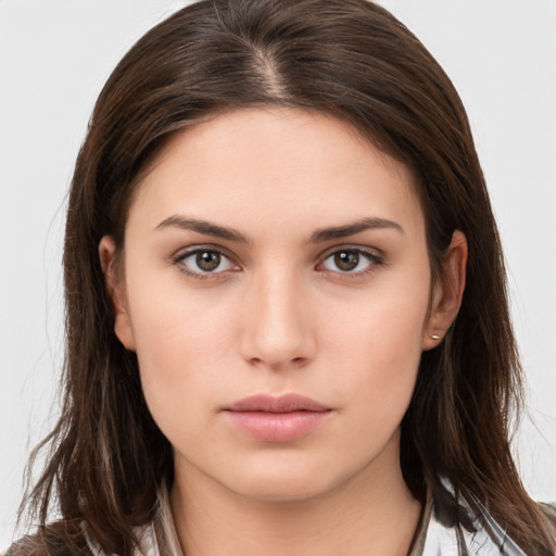 Neutral white young-adult female with long  brown hair and brown eyes