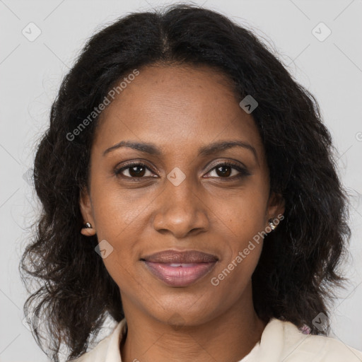 Joyful black adult female with medium  brown hair and brown eyes