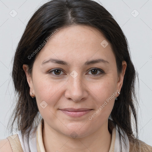 Joyful white adult female with medium  brown hair and brown eyes