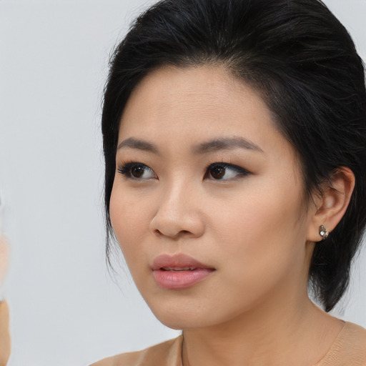 Neutral asian young-adult female with medium  brown hair and brown eyes