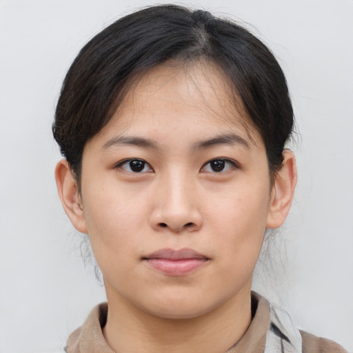 Neutral asian young-adult female with medium  brown hair and brown eyes
