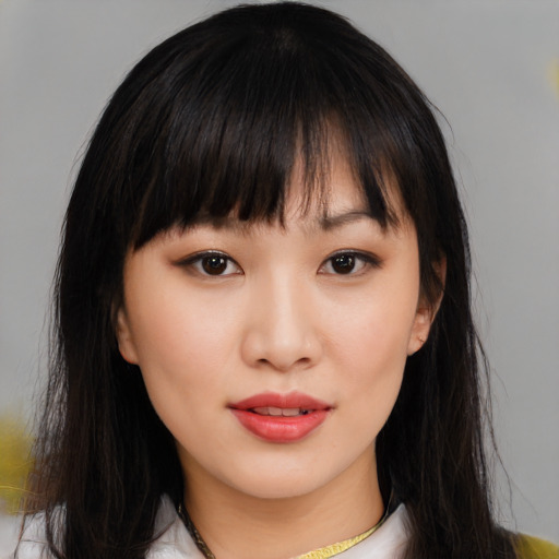 Neutral asian young-adult female with medium  brown hair and brown eyes