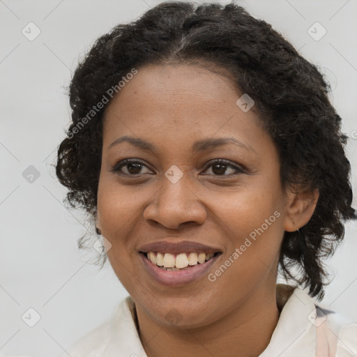 Joyful black young-adult female with long  brown hair and brown eyes