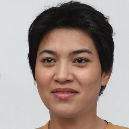 Joyful asian young-adult female with short  black hair and brown eyes