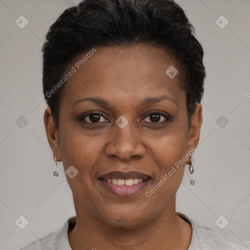 Joyful black adult female with short  black hair and brown eyes