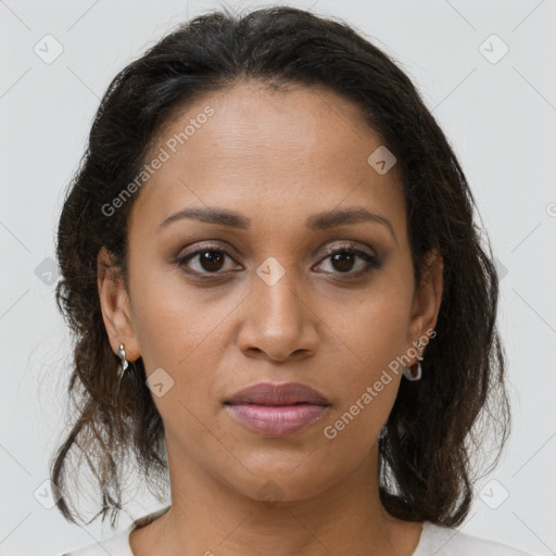 Joyful black young-adult female with medium  brown hair and brown eyes