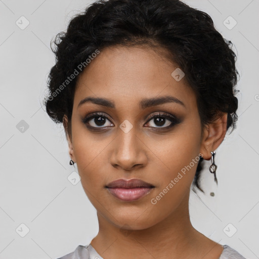 Joyful latino young-adult female with short  black hair and brown eyes