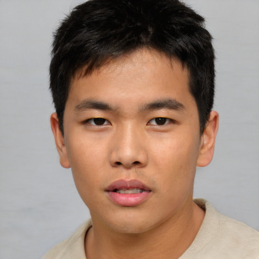 Neutral asian young-adult male with short  brown hair and brown eyes