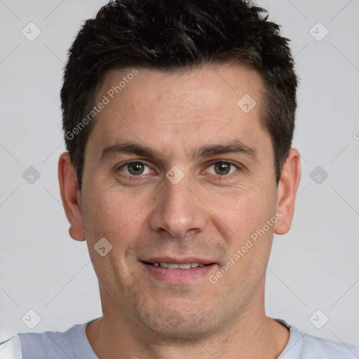 Joyful white adult male with short  brown hair and brown eyes