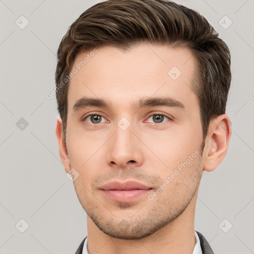 Neutral white young-adult male with short  brown hair and grey eyes