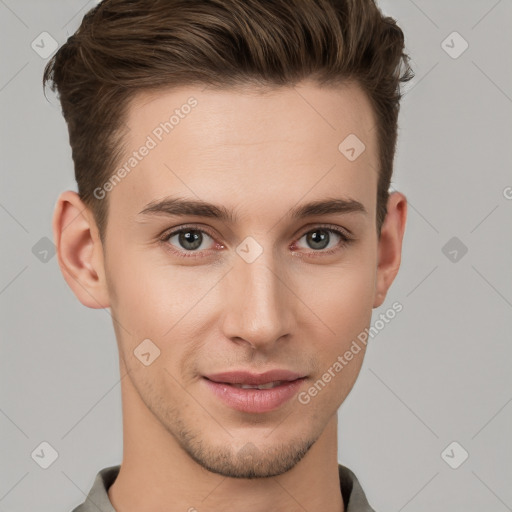 Joyful white young-adult male with short  brown hair and grey eyes