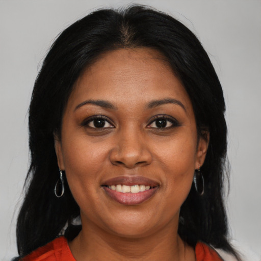 Joyful black young-adult female with medium  black hair and brown eyes