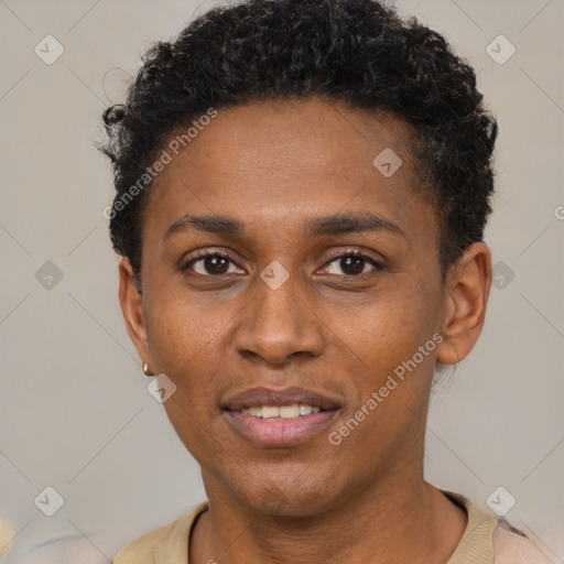 Joyful black young-adult male with short  brown hair and brown eyes