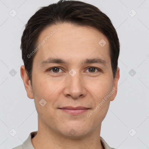 Joyful white young-adult male with short  brown hair and brown eyes