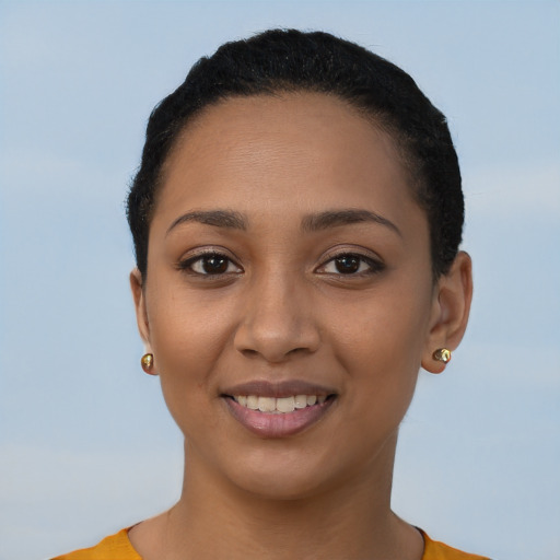 Joyful latino young-adult female with short  brown hair and brown eyes