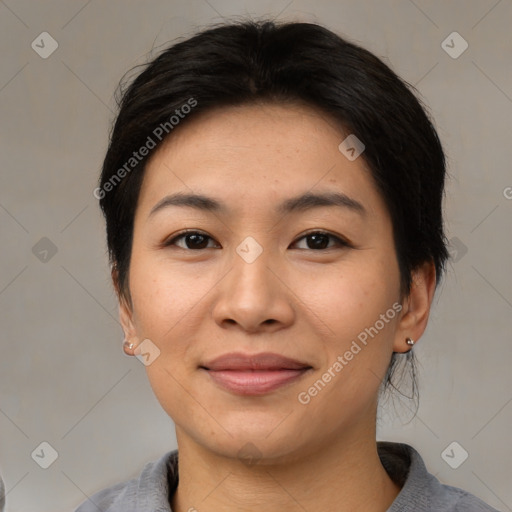 Joyful asian young-adult female with medium  brown hair and brown eyes