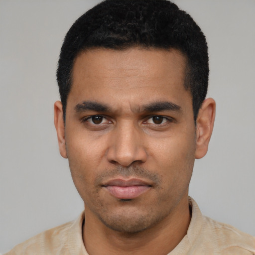 Neutral latino young-adult male with short  black hair and brown eyes