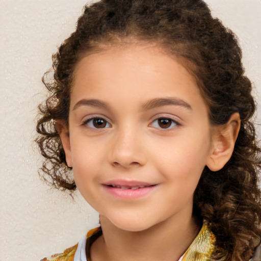 Joyful white child female with medium  brown hair and brown eyes