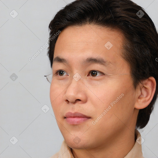 Neutral asian young-adult male with short  brown hair and brown eyes