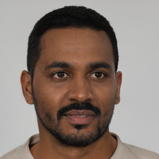 Neutral black young-adult male with short  black hair and brown eyes
